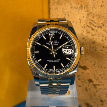 Pre-owned certified Rolex Datejust Black 36mm Steel & Yellow Gold reference 116233 from 2009 in Geneva - Certified pre-owned - Minty Watches
