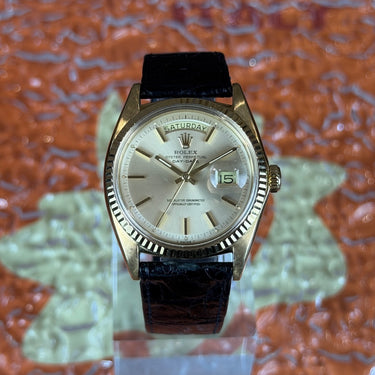 certified pre-owned Rolex Day-Date champagne dial 36mm reference 1803 with leather strap from 1971 in Geneva - Certified pre-owned - Minty Watches