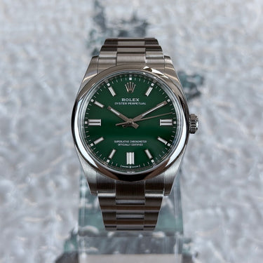 certified pre-owned Rolex Oyster Perpetual with green dial in 36mm reference 126000 from 2022 in Geneva - Certified pre-owned - Minty Watches