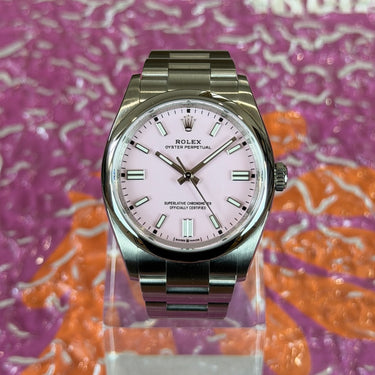 certified pre-owned Rolex Oyster Perpetual rose dial 36mm reference 126000 from 2022 in Geneva - Certified pre-owned - Minty Watches