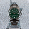 certified pre-owned Rolex Oyster Perpetual with green dial in 36mm reference 126000 from 2022 in Geneva - Certified pre-owned - Minty Watches